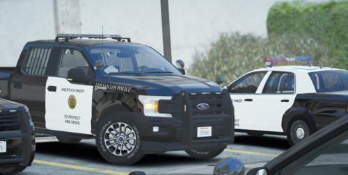 Could contain: land vehicle, wheel, tire, outdoor, auto part, law enforcement, bumper, automotive exterior, sport utility vehicle, motor vehicle, text, roof rack, police car, car, transport, automotive luggage rack, automotive tire, automotive carrying rack, fender, pickup truck, compact sport utility vehicle, vehicle registration plate, ford, road, police, emergency, vehicle