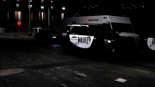 Could contain: vehicle, land vehicle, wheel, tire, outdoor, transport, road, auto part, van, police, street, night, parked