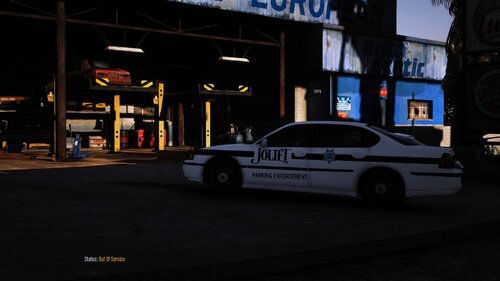 Could contain: vehicle, land vehicle, text, outdoor, wheel, building, road, auto part, street, transport, night, light, police, car, city, parked