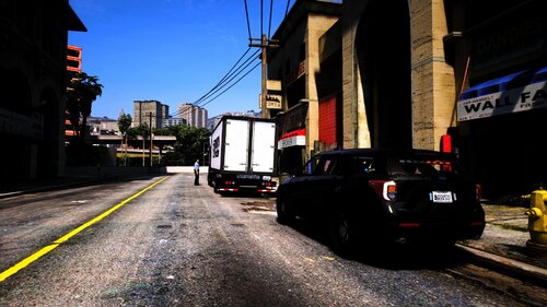 Could contain: outdoor, sky, land vehicle, vehicle, road, building, wheel, text, vehicle registration plate, tire, road surface, car, way, infrastructure, auto part, city, ground, street, light, parked