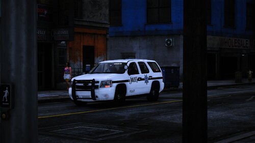 Could contain: vehicle, land vehicle, wheel, transport, building, outdoor, tire, road, car, street, police, parked