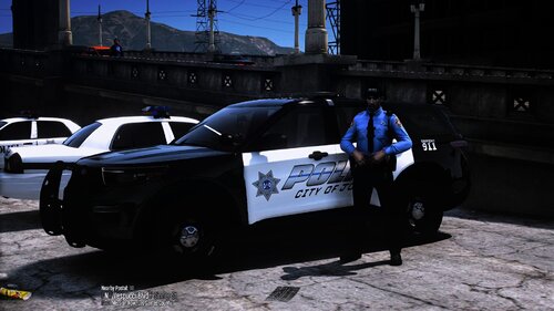 Could contain: vehicle, outdoor, land vehicle, wheel, text, tire, building, auto part, police, ground, street, car, officer