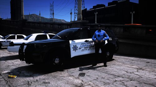 Could contain: vehicle, outdoor, land vehicle, wheel, tire, auto part, text, sky, transport, ground, road, police, street, car