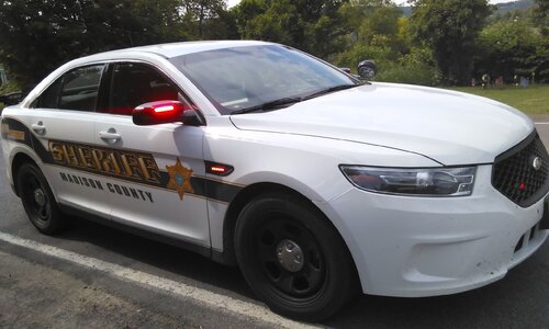 Could contain: vehicle, land vehicle, wheel, outdoor, text, tire, full-size car, auto part, mid-size car, police car, bumper, vehicle registration plate, ford, law enforcement, police, transport, car