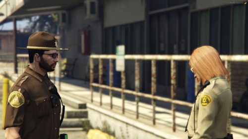 Could contain: person, building, clothing, human face, man, helmet, fashion accessory, security, police officer, outdoor, officer, street, police, military uniform, uniform, wearing