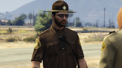 Could contain: clothing, outdoor, person, hat, human face, sky, man, fashion accessory, fedora, headgear, sun hat, helmet, military uniform, mountain, wearing