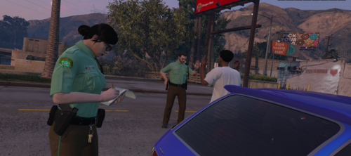 Could contain: outdoor, clothing, person, sky, man, tree, road, waste container, vehicle, car, people, street, standing, ground, mountain