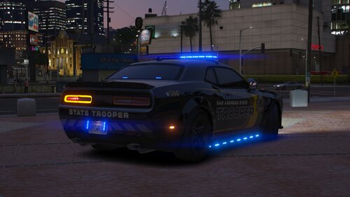 Could contain: vehicle, land vehicle, wheel, outdoor, building, tire, night, automotive design, sports car, mid-size car, car, road, automotive light bulb, text, full-size car, automotive lighting, sports sedan, performance car, auto part, street, ground, light