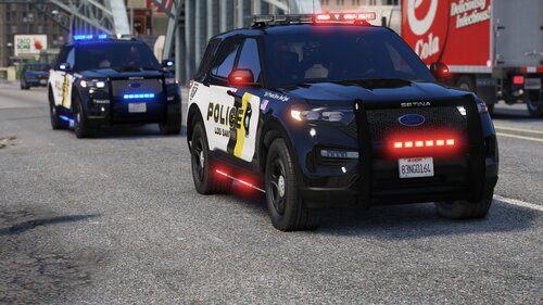 Could contain: land vehicle, vehicle, text, wheel, tire, outdoor, vehicle registration plate, road, car, police car, law enforcement, auto part, full-size car, mid-size car, bumper, automotive design, automotive light bulb, automotive exterior, street, police