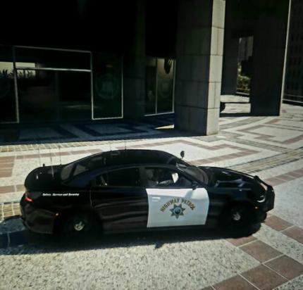 Could contain: vehicle, land vehicle, wheel, outdoor, tire, building, ground, auto part, automotive exterior, transport, road, car, parked, police, curb