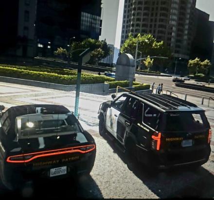 Could contain: vehicle, land vehicle, outdoor, wheel, text, vehicle registration plate, building, road, luxury vehicle, car, tire, transport, street, city, ground, police