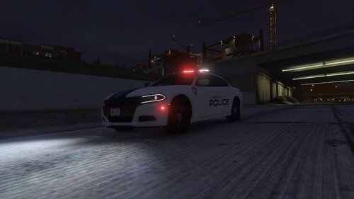 Could contain: vehicle, land vehicle, wheel, road, transport, outdoor, automotive lighting, tire, light, car, ground, street, night