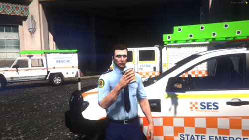 Could contain: land vehicle, text, vehicle, person, clothing, wheel, outdoor, man, car, tire, emergency vehicle, ambulance, van, street