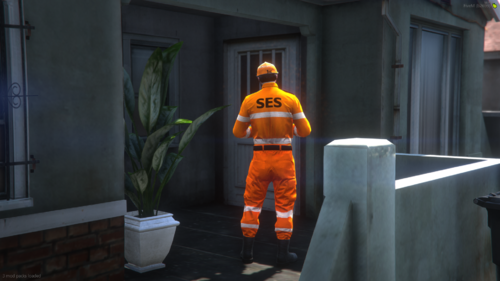 Could contain: building, waste container, outdoor, orange, protective garment, ground