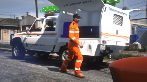 Could contain: vehicle, outdoor, wheel, land vehicle, truck, tire, road, orange, clothing, person, footwear, ground, street