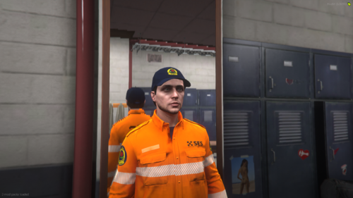 Could contain: clothing, person, human face, man, smile, workwear, orange, wearing, standing, jacket, uniform, yellow