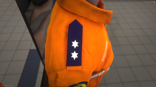 Could contain: luggage and bags, orange, clothing, life jacket, backpack