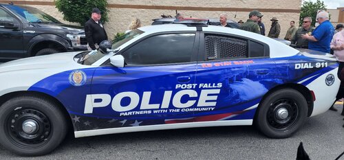 Could contain: vehicle, text, land vehicle, transport, wheel, car, tire, outdoor, police car, law enforcement, full-size car, automotive exterior, auto part, police