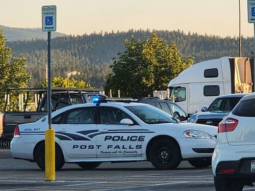 Could contain: vehicle, land vehicle, text, outdoor, wheel, transport, sky, full-size car, police car, law enforcement, mid-size car, car, vehicle registration plate, tire, sedan, sports sedan, ford crown victoria police interceptor, auto part, road, street, police