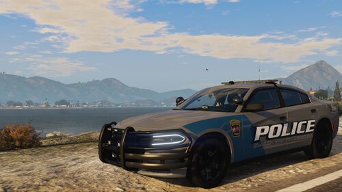 Could contain: vehicle, land vehicle, outdoor, sky, wheel, tire, transport, text, car, bumper, sedan, mountain, ground, parked