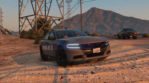 Could contain: outdoor, vehicle, land vehicle, wheel, sky, ground, tire, mountain, car, bumper, auto part, automotive design, desert, track