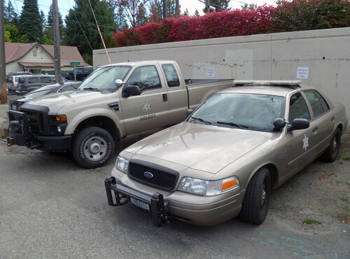 Could contain: vehicle, land vehicle, wheel, tire, outdoor, bumper, auto part, transport, sedan, vehicle registration plate, hardtop, automotive parking light, parked, automotive exterior, grille, motor vehicle, parking lot, full-size car, family car, automotive side marker light, hood, fender, bmw, ford, car, parking, ground