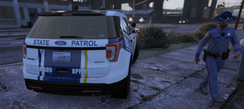 Could contain: text, vehicle, land vehicle, outdoor, clothing, vehicle registration plate, tire, wheel, car, road, ground, rally, person, street, van, police