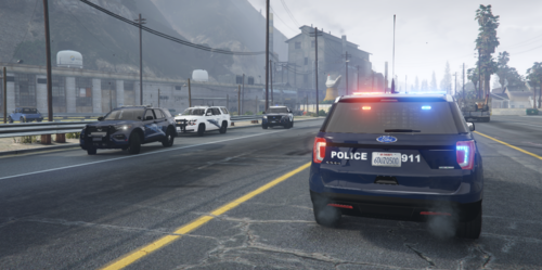 Could contain: vehicle, text, land vehicle, outdoor, wheel, road, vehicle registration plate, sky, tire, auto part, automotive exterior, automotive tail & brake light, family car, street, motor vehicle, lane, automotive lighting, highway, road surface, asphalt, automotive parking light, thoroughfare, sport utility vehicle, mode of transport, traffic, driving, city, police, light, car