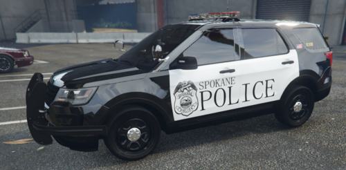 Could contain: vehicle, land vehicle, tire, wheel, text, transport, auto part, motor vehicle, sport utility vehicle, fender, outdoor, automotive exterior, bumper, automotive tire, car, police, compact sport utility vehicle, vehicle registration plate, ford, road, street, parked