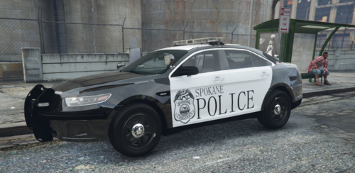 Could contain: vehicle, land vehicle, wheel, tire, outdoor, text, auto part, car, transport, police car, law enforcement, full-size car, road, street, ground, police