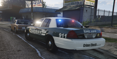 Could contain: text, vehicle, land vehicle, outdoor, wheel, vehicle registration plate, transport, road, car, auto part, police car, law enforcement, ford crown victoria police interceptor, police, full-size car, tire, automotive exterior, street, ground