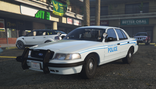 Could contain: vehicle, land vehicle, wheel, transport, car, outdoor, full-size car, tire, sedan, ford crown victoria police interceptor, text, bumper, vehicle registration plate, police car, law enforcement, police, mid-size car, parked