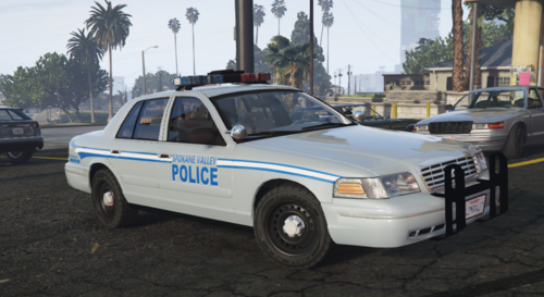 Could contain: vehicle, land vehicle, wheel, transport, outdoor, text, tire, full-size car, police car, law enforcement, ford crown victoria police interceptor, sedan, police, vehicle registration plate, auto part, car, parked