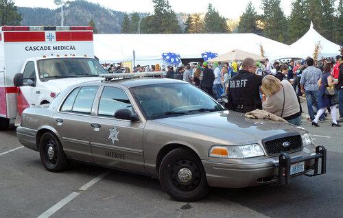 Could contain: vehicle, land vehicle, wheel, transport, outdoor, tire, sedan, bumper, ford crown victoria police interceptor, hardtop, police, car, parked, person