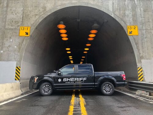 Could contain: vehicle, land vehicle, tire, wheel, road, auto part, outdoor, truck, car, infrastructure, tunnel