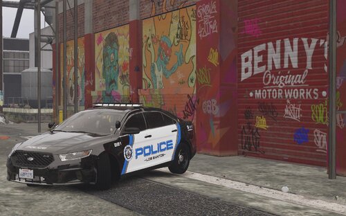 Could contain: text, vehicle, land vehicle, wheel, building, tire, outdoor, mid-size car, sports sedan, full-size car, vehicle registration plate, auto part, sedan, road, car, ground, street, police