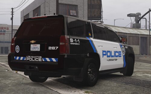 Could contain: text, vehicle, land vehicle, wheel, outdoor, tire, vehicle registration plate, auto part, automotive exterior, transport, building, motor vehicle, police car, road, law enforcement, automotive tail & brake light, bumper, sport utility vehicle, van, street, police, car