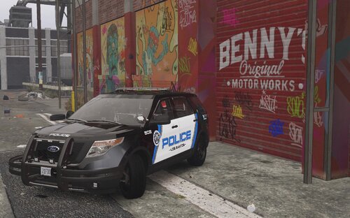 Could contain: text, vehicle, land vehicle, wheel, tire, outdoor, building, transport, auto part, vehicle registration plate, automotive exterior, ground, road, street, parked, police, sign, car, city