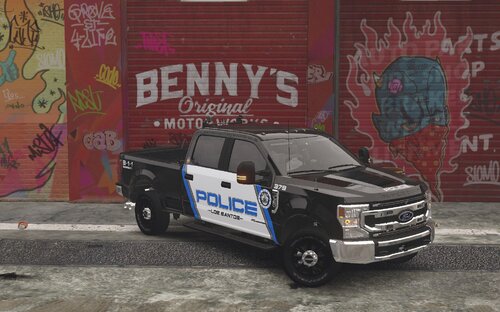 Could contain: text, vehicle, land vehicle, tire, wheel, outdoor, building, truck, bumper, ground, painted, parked, graffiti, car