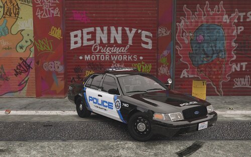 Could contain: text, vehicle, land vehicle, wheel, tire, outdoor, building, transport, vehicle registration plate, car, ground, graffiti