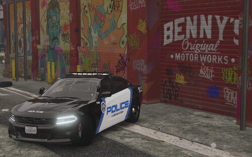 Could contain: text, vehicle, land vehicle, wheel, tire, outdoor, automotive design, sports car, ground, building, vehicle registration plate, bumper, performance car, auto part, road, transport, street, parked, car