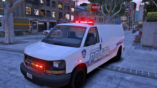 Could contain: vehicle, land vehicle, transport, outdoor, text, wheel, building, police, vehicle registration plate, emergency vehicle, emergency service, car, van, emergency, light commercial vehicle, ambulance, minivan, ground, street, parked