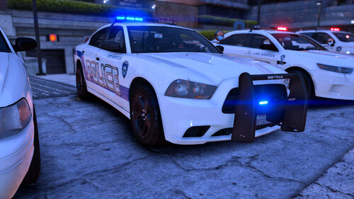 Could contain: land vehicle, vehicle, wheel, tire, full-size car, outdoor, police car, transport, automotive light bulb, law enforcement, mid-size car, police, auto part, sports sedan, car, ground