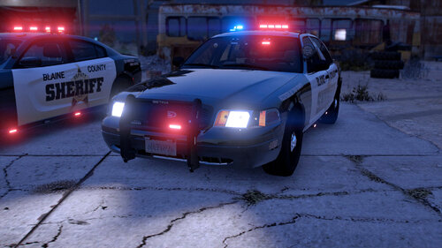 Could contain: vehicle, land vehicle, outdoor, wheel, transport, text, car, automotive lighting, tire, vehicle registration plate, automotive parking light, law enforcement, auto part, road, automotive tail & brake light, police car, automotive exterior, full-size car, street, ground, light, police