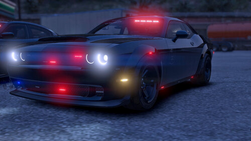 Could contain: vehicle, land vehicle, wheel, sports car, automotive lighting, road, automotive design, car, outdoor, auto part, performance car, bumper, hood, sports sedan, automotive tail & brake light, automotive light bulb, spoiler, ground, light