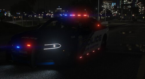 Could contain: vehicle, land vehicle, outdoor, car, automotive lighting, vehicle registration plate, automotive tail & brake light, road, wheel, light, text, mid-size car, sports sedan, auto part, night, street, city, police