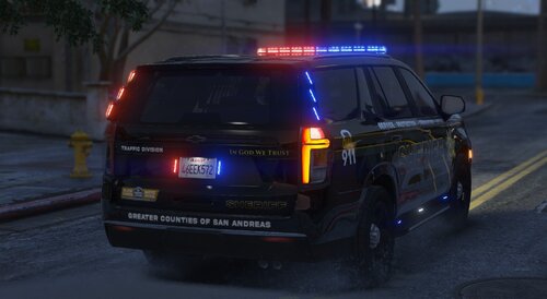 Could contain: vehicle, land vehicle, text, wheel, outdoor, tire, transport, vehicle registration plate, auto part, sport utility vehicle, road, police car, automotive exterior, law enforcement, roof rack, automotive tail & brake light, ford, automotive lighting, car, automotive luggage rack, emergency service, emergency vehicle, police, bumper, automotive side marker light, street, driving, light