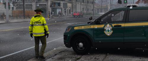 Could contain: vehicle, land vehicle, outdoor, wheel, text, tire, clothing, person, emergency service, road, street, transport, auto part, yellow, police, car, jacket