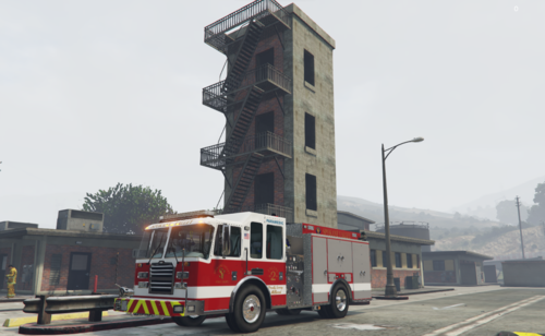 Could contain: sky, outdoor, vehicle, land vehicle, wheel, building, road, firefighter, transport, truck, fire department, mode of transport, street, red, tower, fire, city, driving, bus