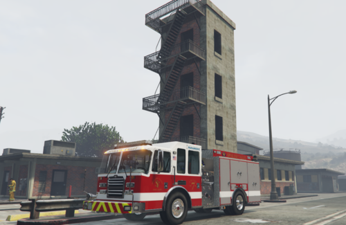 Could contain: sky, outdoor, vehicle, land vehicle, wheel, building, road, firefighter, transport, fire department, street, fire apparatus, fire, truck, red, driving, tower, city